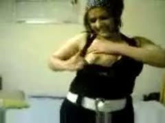 An attractive and plump Arab woman flaunting her enormous breasts on a do-it-yourself webcam
